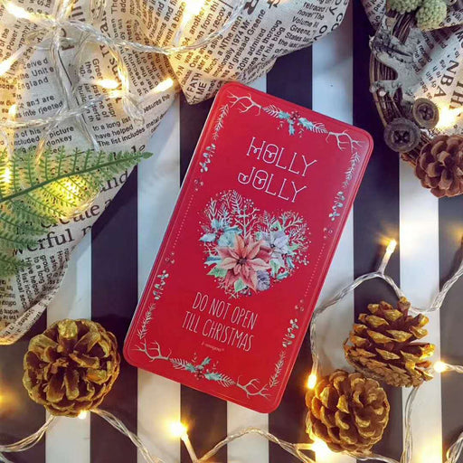 red holly jolly gift tin